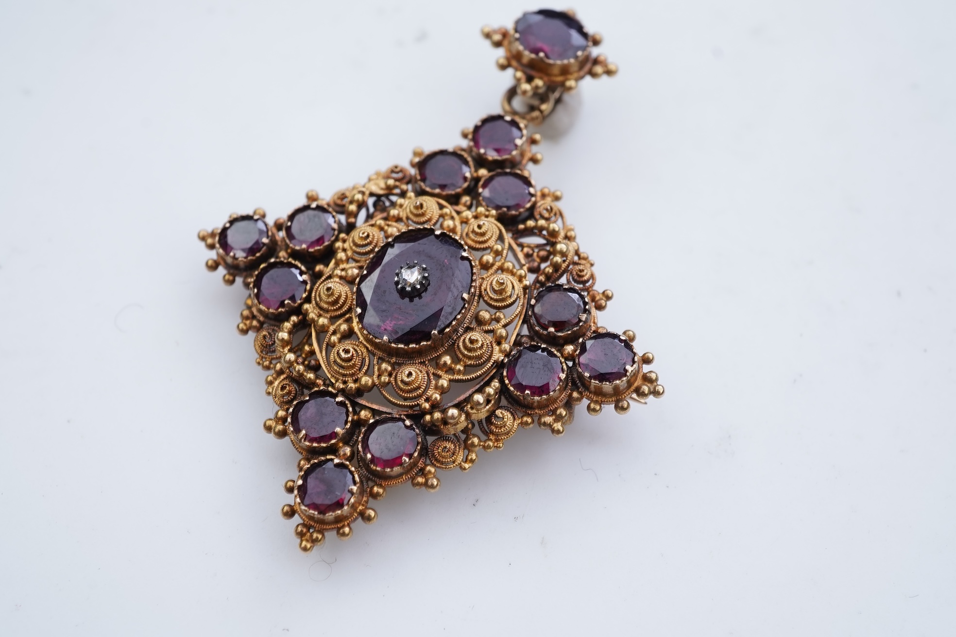 A late Georgian garnet pendant/brooch, 1830s